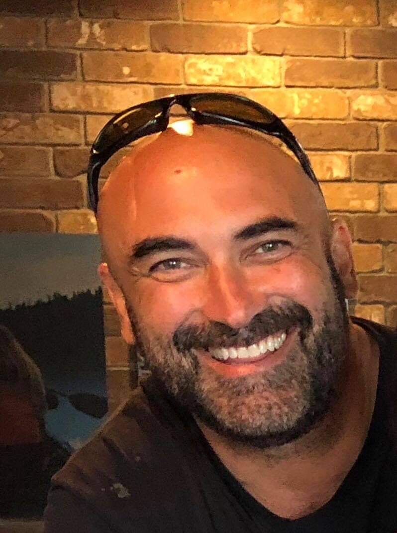 Bison cow and calf in green pasture